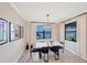 Bright dining room with large windows and lake view at 24176 Spartina Dr, Venice, FL 34293
