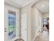 Bright entryway with glass-paned door and tile flooring at 24176 Spartina Dr, Venice, FL 34293