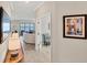 Bright entryway with view of living room and lake at 24176 Spartina Dr, Venice, FL 34293