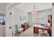 Spacious home office with built-in bookcases and large desk at 24176 Spartina Dr, Venice, FL 34293