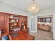 Home office features a large desk and built-in shelving at 24176 Spartina Dr, Venice, FL 34293