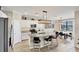 Modern kitchen with island, stainless steel appliances, and breakfast bar at 24176 Spartina Dr, Venice, FL 34293