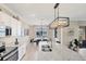 Kitchen with island, granite countertops, and lake view at 24176 Spartina Dr, Venice, FL 34293