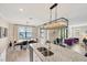 Kitchen island with double sink and lake view at 24176 Spartina Dr, Venice, FL 34293
