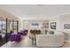 Relaxing living room with water view, comfy seating and large TV at 24176 Spartina Dr, Venice, FL 34293
