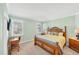 Main bedroom with king-size bed and ensuite bathroom at 24176 Spartina Dr, Venice, FL 34293
