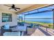 Spacious screened patio furniture with tranquil lake views at 24176 Spartina Dr, Venice, FL 34293