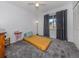 Cozy bedroom with a yellow matress and gray carpet at 3181 Nekoosa St, North Port, FL 34287