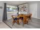 Bright dining area with wooden table and wicker chairs at 3181 Nekoosa St, North Port, FL 34287