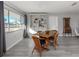 Bright dining area with wooden table and wicker chairs at 3181 Nekoosa St, North Port, FL 34287