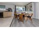 Bright dining area with wooden table and wicker chairs at 3181 Nekoosa St, North Port, FL 34287