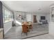 Open concept dining area with built-in shelving and a wooden table at 3181 Nekoosa St, North Port, FL 34287