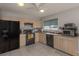 Well-equipped kitchen featuring modern appliances and ample cabinetry at 3181 Nekoosa St, North Port, FL 34287