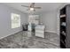 Home office with gray vinyl flooring and built-in shelving at 3181 Nekoosa St, North Port, FL 34287