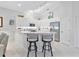 Modern kitchen with white cabinets and stainless steel appliances at 335 Rio Terra, Venice, FL 34285