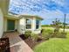 Welcoming house entrance with a brick walkway and manicured landscaping at 3648 Pebble Ter, Punta Gorda, FL 33980