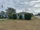 House with light teal exterior, landscaping, and a street view at 375 58Th N St, St Petersburg, FL 33710