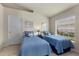 Guest bedroom with twin beds, window, and closet at 3897 Fairway Dr, North Port, FL 34287