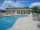 Relaxing community pool with surrounding patio at 3897 Fairway Dr, North Port, FL 34287