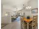 Bright dining room with a wooden table and chairs near kitchen and living room at 3897 Fairway Dr, North Port, FL 34287