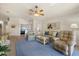 Open living space with a seating area, view of the dining area and Primary bedroom at 3897 Fairway Dr, North Port, FL 34287