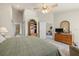 Main bedroom with ensuite access and views of the back yard at 3897 Fairway Dr, North Port, FL 34287