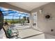 Spacious screened-in patio with seating area at 3897 Fairway Dr, North Port, FL 34287