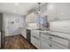 White kitchen with farmhouse sink and stainless steel appliances at 4 Casa Rio Dr # 4, Englewood, FL 34223