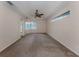 Spacious main bedroom with carpet flooring and a window at 4010 S Cranberry Blvd, North Port, FL 34286