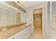 Bathroom with granite countertop, walk-in shower, and linen closet at 4765 Oak Forest W Dr # 47, Sarasota, FL 34231