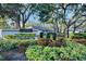 Community entrance with lush landscaping and signage at 4765 Oak Forest W Dr # 47, Sarasota, FL 34231