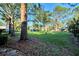 View of the community with lush landscaping and trees at 4765 Oak Forest W Dr # 47, Sarasota, FL 34231