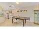 Dining area with rustic wooden table and chairs, adjacent to the kitchen at 4765 Oak Forest W Dr # 47, Sarasota, FL 34231