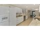 Modern kitchen with white cabinets, granite countertops, and stainless steel appliances at 4765 Oak Forest W Dr # 47, Sarasota, FL 34231