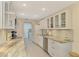 Modern kitchen with white cabinets, granite countertops and stainless steel appliances at 4765 Oak Forest W Dr # 47, Sarasota, FL 34231