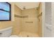 Walk-in shower with tiled walls and grab bar at 4765 Oak Forest W Dr # 47, Sarasota, FL 34231
