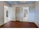 A hallway with wood floors and views into other rooms at 554 Everest Rd, Venice, FL 34293