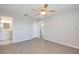 Bright bedroom with wood-look floors and access to bathroom at 58 Circlewood Dr # A1-5, Venice, FL 34293