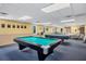 Community game room with pool table and ping pong at 58 Circlewood Dr # A1-5, Venice, FL 34293