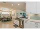 Modern kitchen with a farmhouse sink and light-colored cabinetry at 5837 Semolino St, Nokomis, FL 34275