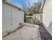 Small, paved patio with gate access and rock garden at 631 Ironwood Cir # 148, Venice, FL 34292