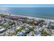 Aerial view showcases houses, a sandy beach and tranquil turquoise ocean at 6405 Gulf Dr, Holmes Beach, FL 34217