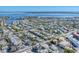 Wide aerial view of a coastal community, highlighting nearby waterway access at 6405 Gulf Dr, Holmes Beach, FL 34217