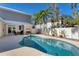 Beautiful pool and patio are surrounded by lush landscaping and privacy fencing at 6405 Gulf Dr, Holmes Beach, FL 34217