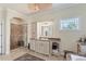 Bathroom with a walk-in shower, single vanity and a tiled floor at 6405 Gulf Dr, Holmes Beach, FL 34217