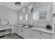Bathroom with dual sinks, granite countertops, and modern fixtures at 6405 Gulf Dr, Holmes Beach, FL 34217