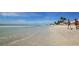 Two women walking along the beach at 6405 Gulf Dr, Holmes Beach, FL 34217