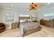 Serene bedroom showcasing a king bed, tiled floor, artwork, and natural light at 6405 Gulf Dr, Holmes Beach, FL 34217