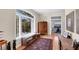 Entry hall with large window, hardwood floors, and a bench seat at 6405 Gulf Dr, Holmes Beach, FL 34217