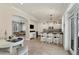 Open kitchen featuring an island with barstools, seamlessly connecting to the dining and living areas at 6405 Gulf Dr, Holmes Beach, FL 34217